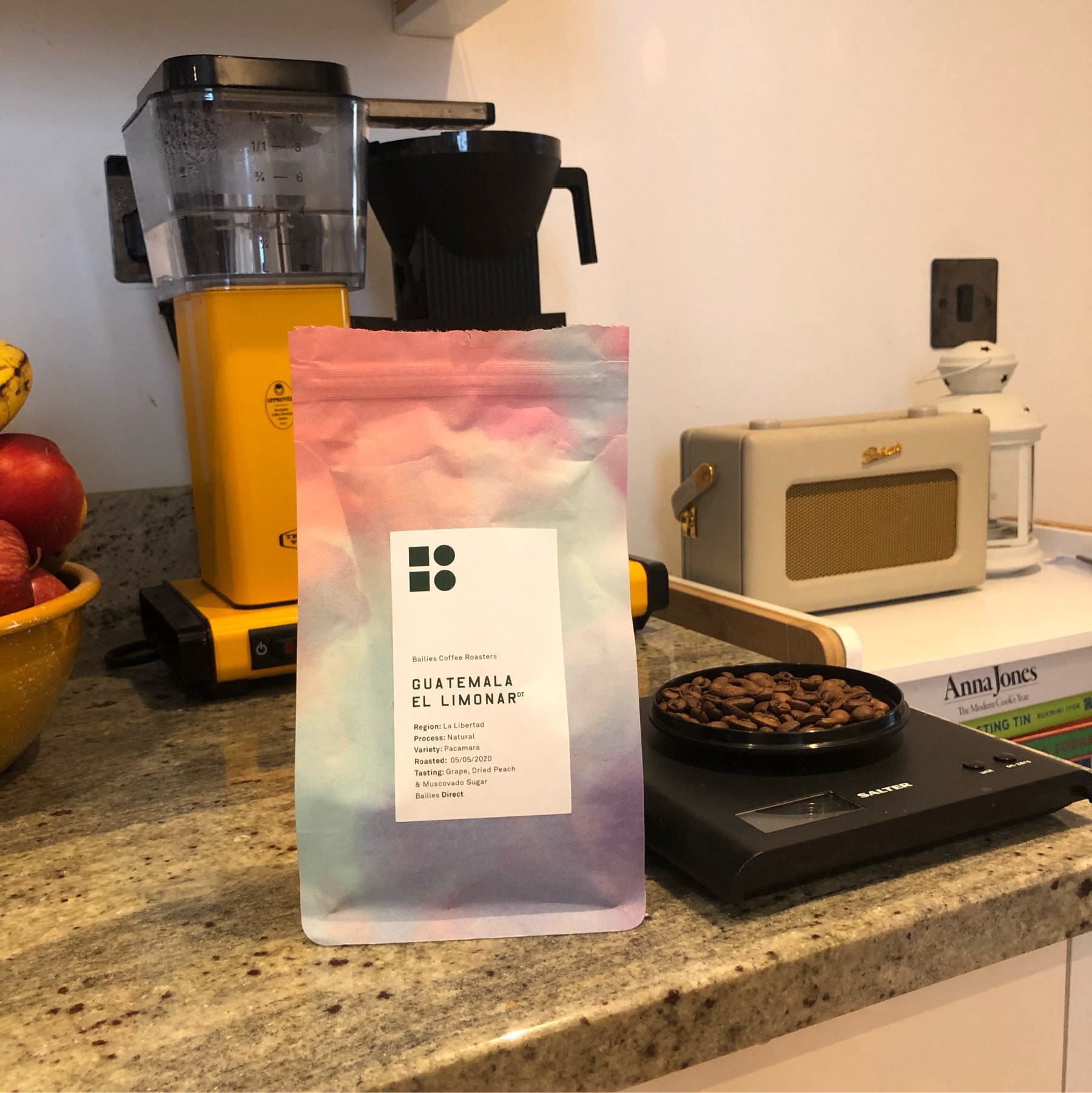 bag of coffee from Bailies coffee in on the kitchen counter next to coffee scales 