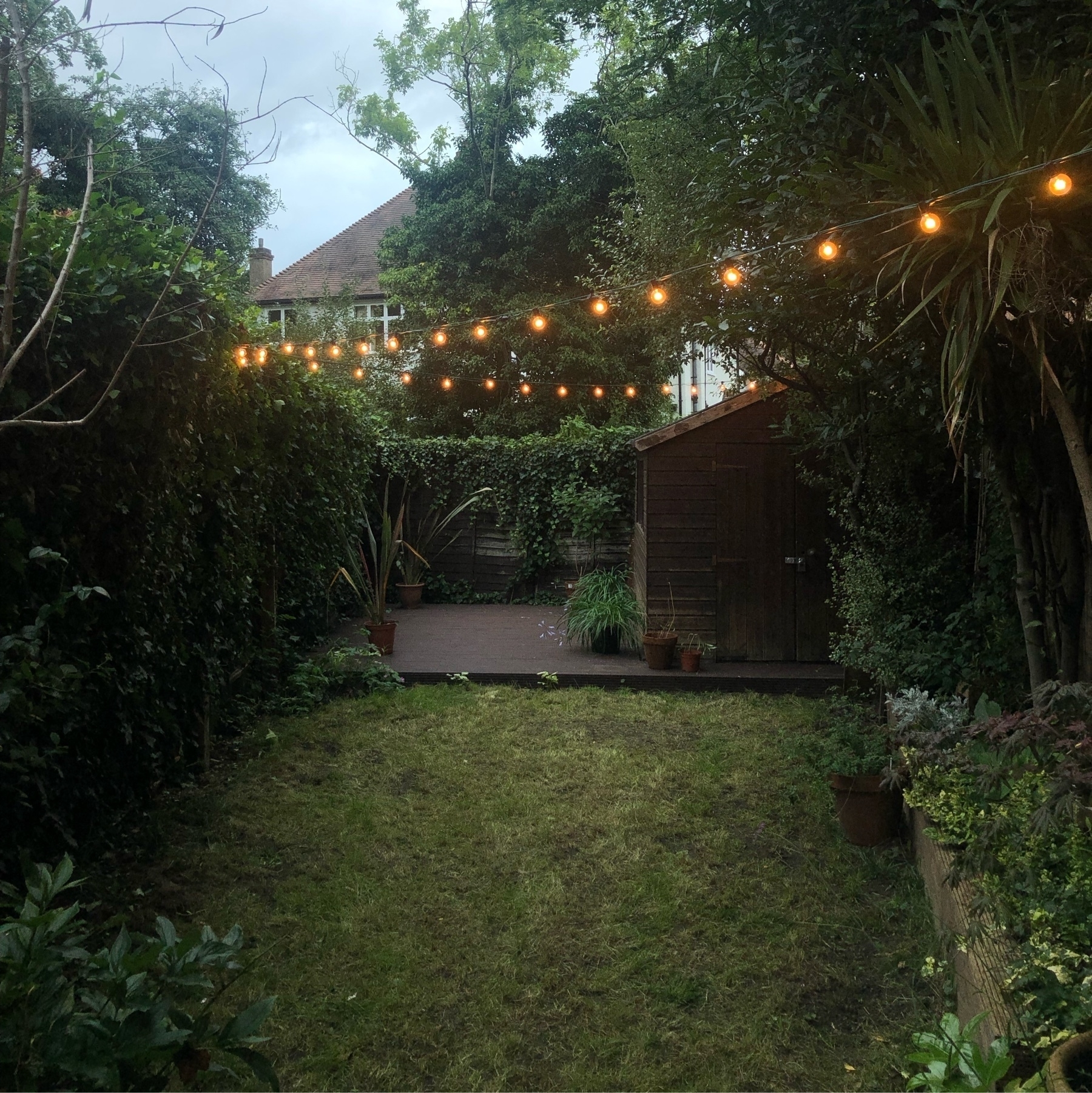 Garden with pendants lights like a triangle